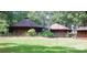 An exterior shot of a home with a unique roof style and chimney at 404 Long Shoals Rd, Bessemer City, NC 28016