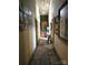View of a narrow hallway featuring tile floors and doors leading to other rooms at 404 Long Shoals Rd, Bessemer City, NC 28016