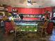 Uniquely designed kitchen features red cabinets, an aquarium, and barstool seating at 404 Long Shoals Rd, Bessemer City, NC 28016