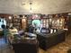 Living room features an assortment of furniture, decor, and a large screen TV at 404 Long Shoals Rd, Bessemer City, NC 28016