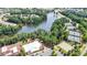 Aerial view of a community featuring a lake, swimming pool, tennis court and manicured green space at 4079 Murray St, Fort Mill, SC 29707