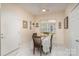 Cozy dining area features bright natural light, a ceiling fan, and a modern table with seating for four at 4079 Murray St, Fort Mill, SC 29707