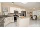 Bright kitchen with white cabinets, stainless steel appliances, and granite countertops at 4079 Murray St, Fort Mill, SC 29707