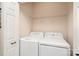 Convenient laundry room with washer, dryer, and wire shelving for storage at 4079 Murray St, Fort Mill, SC 29707