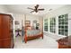 Spacious main bedroom with four-poster bed, ceiling fan, and bright windows at 4079 Murray St, Fort Mill, SC 29707