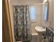 Bathroom with toilet, patterned shower curtain and vanity at 412 Ridge St, Stanley, NC 28164