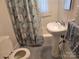 Bathroom with toilet, patterned shower curtain and vanity at 412 Ridge St, Stanley, NC 28164