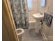 Bathroom with toilet, patterned shower curtain and vanity at 412 Ridge St, Stanley, NC 28164