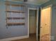 Bedroom with shelves, closet and neutral carpet at 412 Ridge St, Stanley, NC 28164
