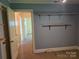 Bedroom with shelves, doorway and neutral carpet at 412 Ridge St, Stanley, NC 28164