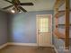 Bedroom with shelves, back door and neutral carpet at 412 Ridge St, Stanley, NC 28164