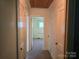 Hallway view featuring doorways and a neutral carpet at 412 Ridge St, Stanley, NC 28164