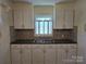 Traditional kitchen featuring ample white cabinetry and a double sink at 412 Ridge St, Stanley, NC 28164