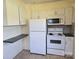 Bright kitchen with white cabinets and appliances at 412 Ridge St, Stanley, NC 28164