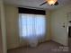 Living room with carpet and decorative curtains at 412 Ridge St, Stanley, NC 28164