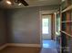View of living room showcasing the entrance to the laundry room with natural light streaming in at 412 Ridge St, Stanley, NC 28164