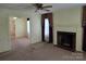 Living room featuring a fireplace and a doorway to another room at 412 Ridge St, Stanley, NC 28164