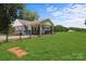 A spacious backyard with a well-maintained lawn and fenced perimeter for privacy and security at 435 Stirewalt Rd, China Grove, NC 28023