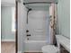 Bathroom features a white shower-tub combo and matching white toilet at 435 Stirewalt Rd, China Grove, NC 28023