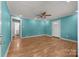 Bright bedroom with wood floors, a ceiling fan, and ample natural light at 435 Stirewalt Rd, China Grove, NC 28023