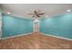 Spacious bedroom featuring light blue walls, wood floors, and a ceiling fan at 435 Stirewalt Rd, China Grove, NC 28023