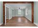 Bedroom featuring wood floors, a ceiling fan, and natural wood accents. Windows offer a view of the outdoors at 435 Stirewalt Rd, China Grove, NC 28023