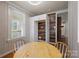 Breakfast nook featuring built in cabinet and rustic wall paneling at 435 Stirewalt Rd, China Grove, NC 28023