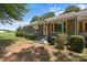 Charming exterior view of the home, featuring fresh paint, shutters and manicured landscaping at 435 Stirewalt Rd, China Grove, NC 28023