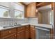 Kitchen showcasing cabinets, stainless dishwasher, and window above the sink at 435 Stirewalt Rd, China Grove, NC 28023