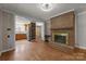 Inviting living area with hardwood floors, fireplace, and open access to the kitchen and dining area at 435 Stirewalt Rd, China Grove, NC 28023