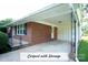 Brick home featuring covered carport and storage at 4429 Dawnwood Dr, Gastonia, NC 28056