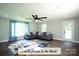 Large Gathering room with modern decor, hardwood floors, and access to the outdoor deck at 4429 Dawnwood Dr, Gastonia, NC 28056