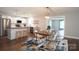 Bright, updated kitchen with stainless steel appliances, wood countertops, and an open dining area with an accent rug at 4429 Dawnwood Dr, Gastonia, NC 28056