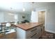 Open kitchen area with a butcher block island, dining table, and access to a spacious pantry at 4429 Dawnwood Dr, Gastonia, NC 28056