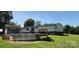 Backyard featuring an above ground pool, wooden deck, and large yard at 4688 Taxahaw Rd, Lancaster, SC 29720