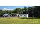 Well-maintained home on a spacious lot with lush lawn and rv at 4688 Taxahaw Rd, Lancaster, SC 29720