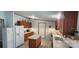 Efficient kitchen with island, white refrigerator, and light countertops at 4688 Taxahaw Rd, Lancaster, SC 29720