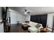 Cozy living room features wood floors, a sectional couch, and ceiling fan at 4688 Taxahaw Rd, Lancaster, SC 29720