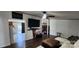 Inviting living room with dark wood floors, ceiling fan, and a glimpse of a fireplace at 4688 Taxahaw Rd, Lancaster, SC 29720
