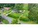 An aerial shot shows the layout of the home, grounds, and location on a well-maintained parcel of land at 5083 Fleetwood Dr, Hickory, NC 28602