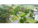 An aerial shows a well-kept home, including mature trees, a circular drive, and convenient road access at 5083 Fleetwood Dr, Hickory, NC 28602