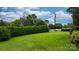 A verdant front yard with a lush, manicured hedge, offering a classic and inviting curb appeal at 5083 Fleetwood Dr, Hickory, NC 28602