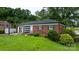 Charming brick home featuring a well-manicured front lawn and decorative shutters at 5083 Fleetwood Dr, Hickory, NC 28602