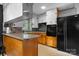 Kitchen with wood cabinets, updated appliances, and a breakfast bar area at 5083 Fleetwood Dr, Hickory, NC 28602