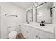 Modern bathroom with dual sinks, quartz countertops, and matte black fixtures at 517 Dutch Ave, Mount Holly, NC 28120