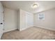 Comfortable carpeted bedroom with double closet and natural light from the single window at 517 Dutch Ave, Mount Holly, NC 28120