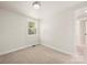 Bright, carpeted bedroom with natural lighting from the large single window at 517 Dutch Ave, Mount Holly, NC 28120