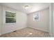 Bright bedroom with neutral carpet, fresh paint, and natural light from two windows at 517 Dutch Ave, Mount Holly, NC 28120