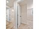 Hallway with hardwood floors and entry to carpeted bedroom at 517 Dutch Ave, Mount Holly, NC 28120