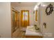 Well-lit bathroom featuring a shower, vanity with sink, and decorative mirror at 517 Fieldcrest Dr, Chester, SC 29706